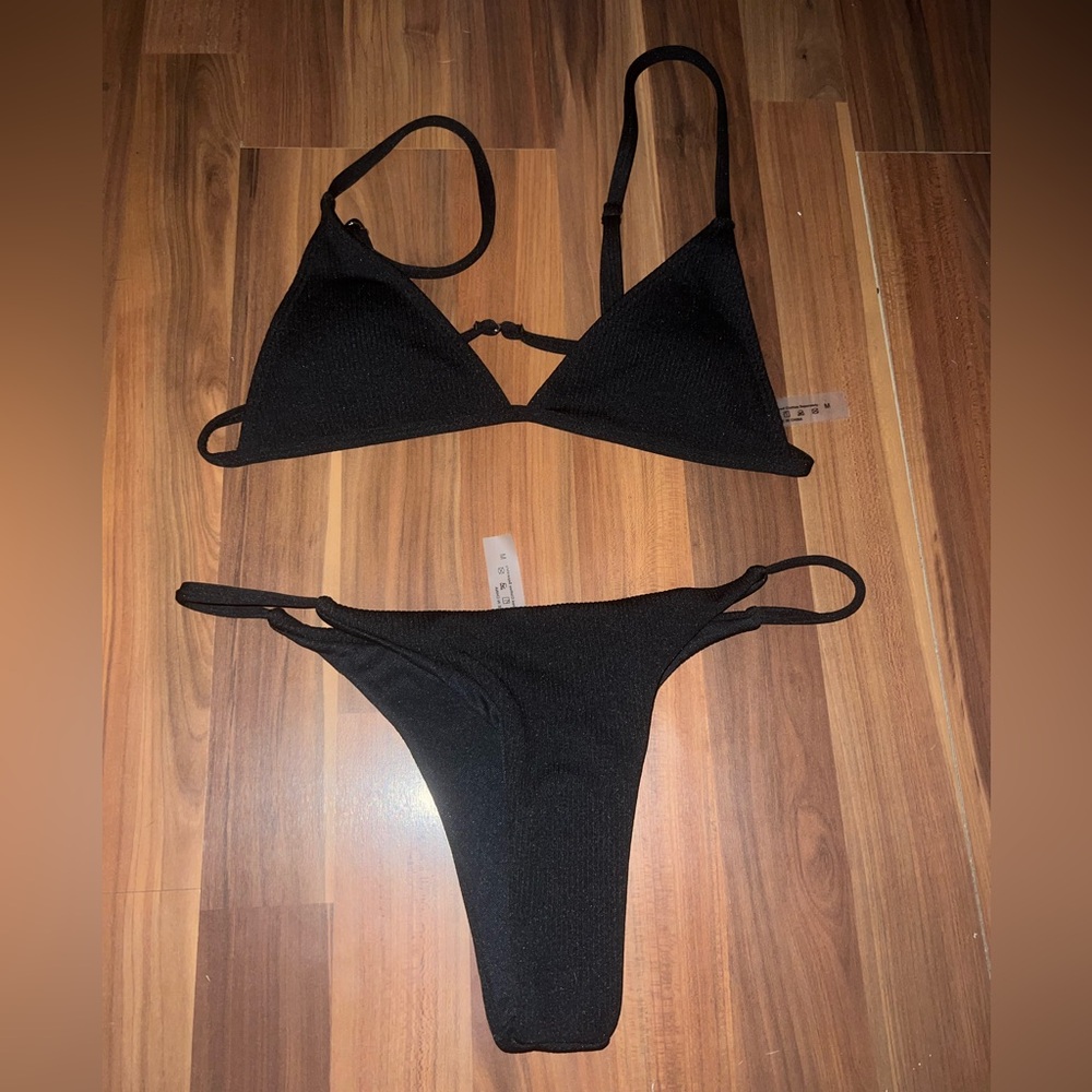 Black, two piece bikini, never worn, fits like a small